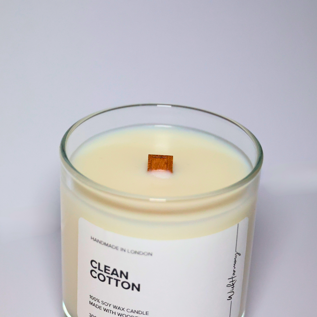 Top view of Clean Cotton soy candle showing wooden wick and creamy soy wax in a clear glass jar